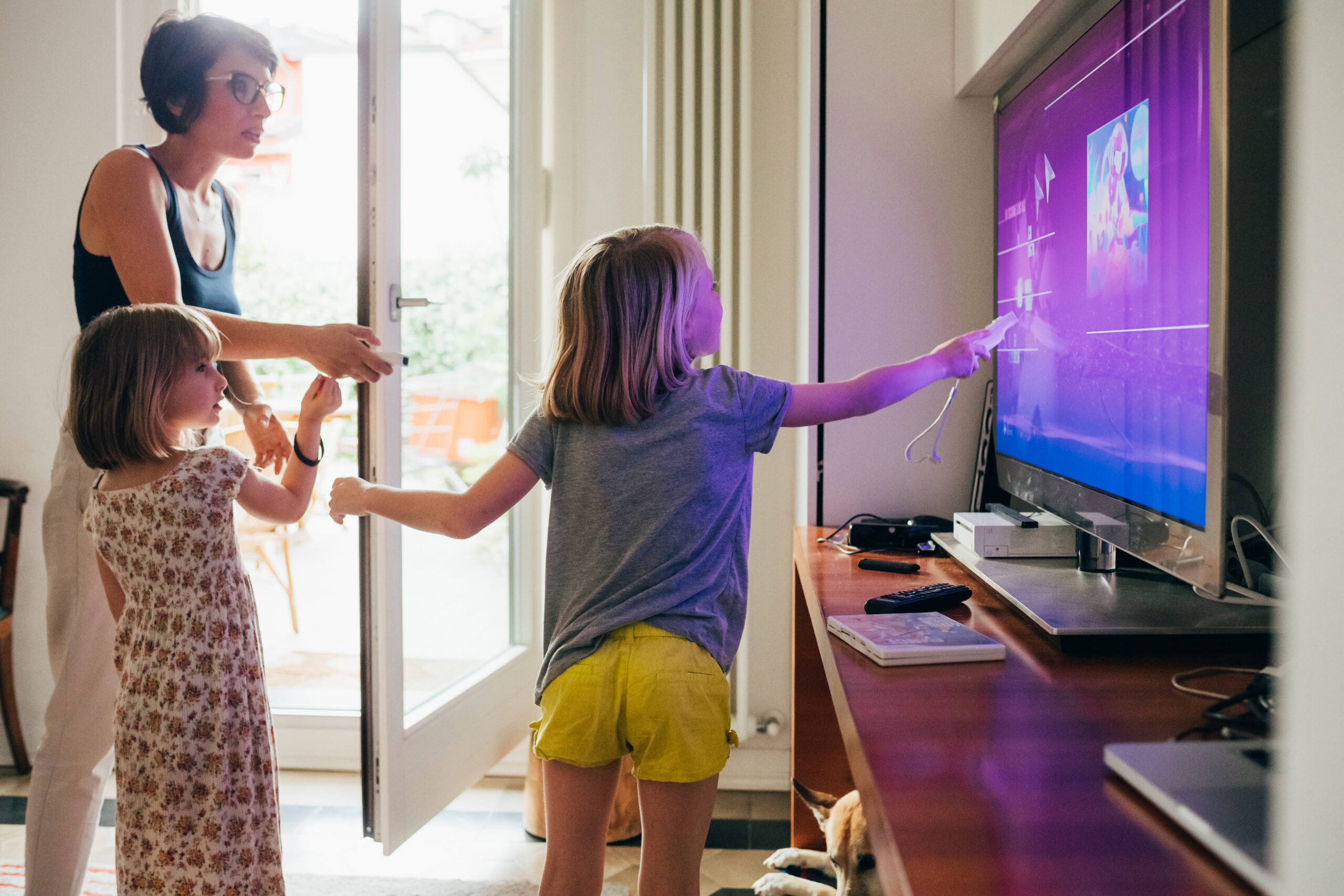 Family together indoor choosing videogame using game console - healthy lifestyle, togetherness, playing concept